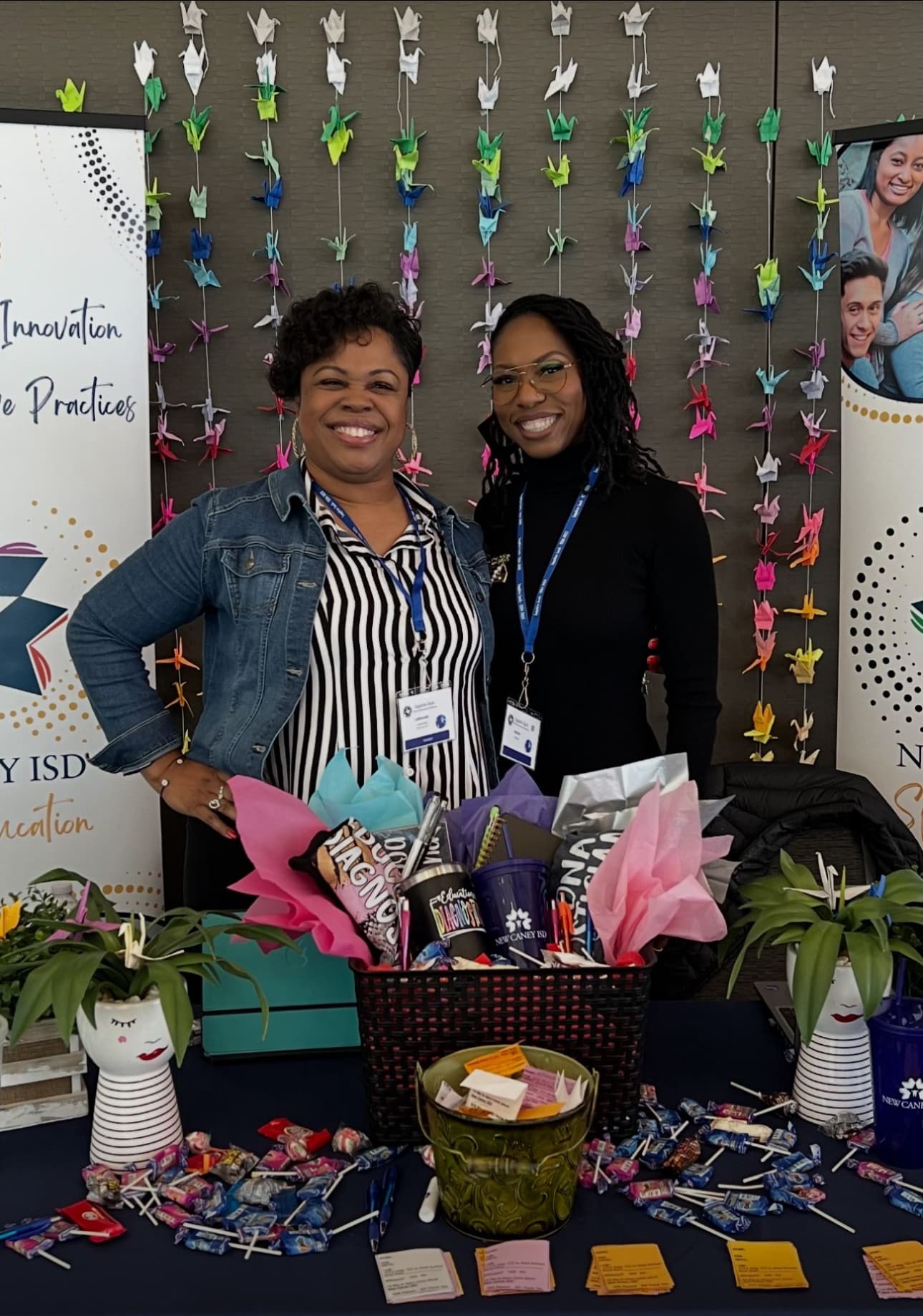 Dr. Natalie Edwards-Hudson at a New Caney ISD special education conference booth decorated with paper cranes
