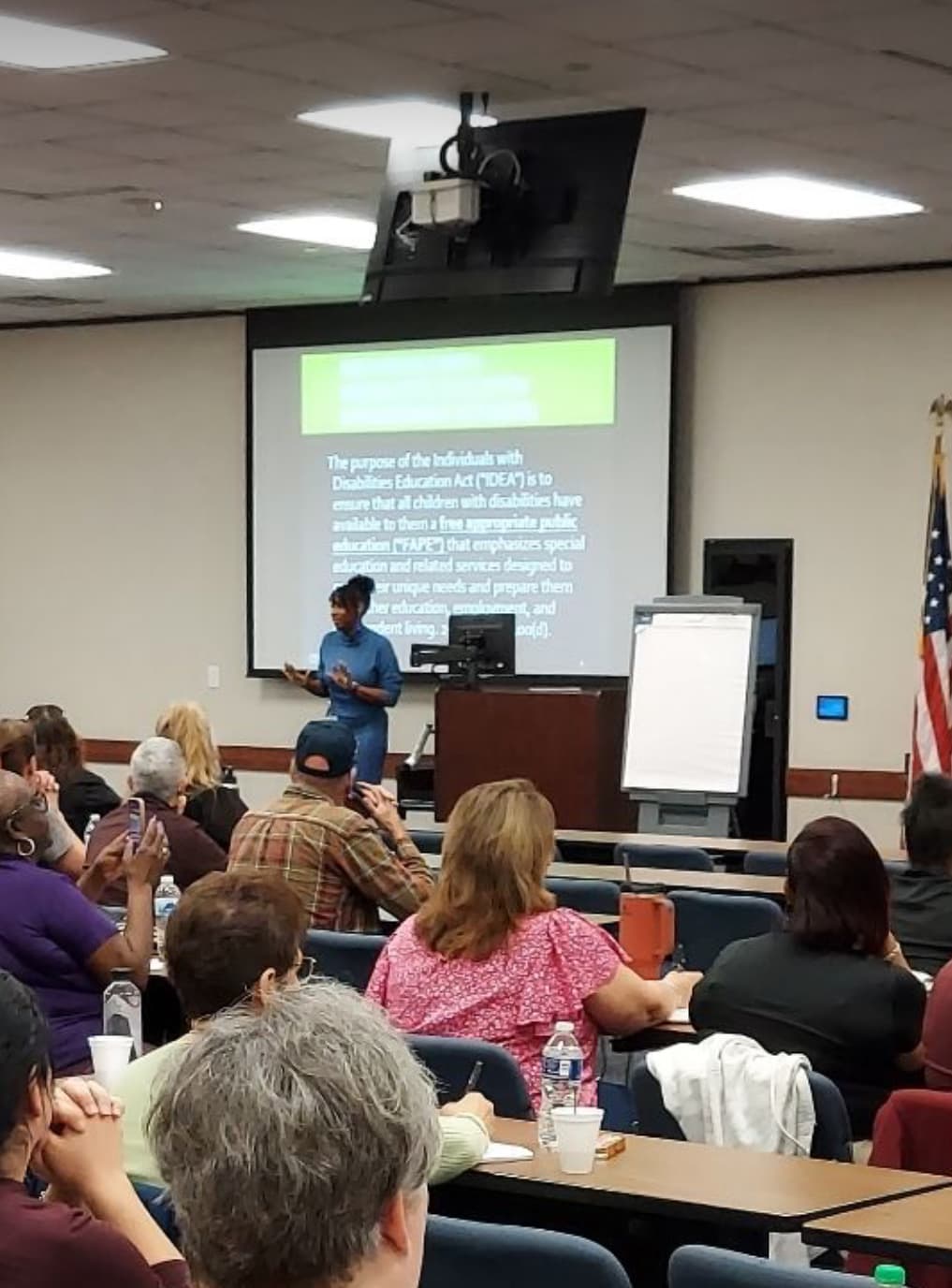 Dr. Natalie Edwards-Hudson presenting on IDEA and FAPE requirements to a seated audience