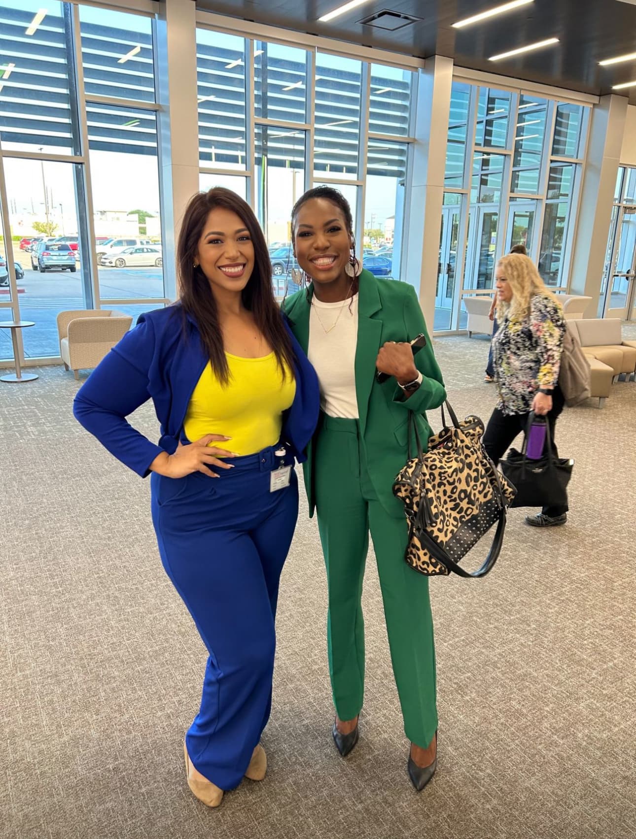 Dr. Natalie Edwards-Hudson posing with a colleague at the TASBO conference booth